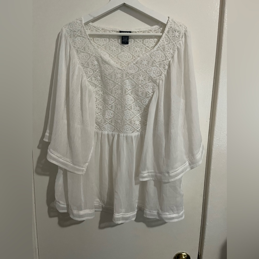 A white lose top from torrid